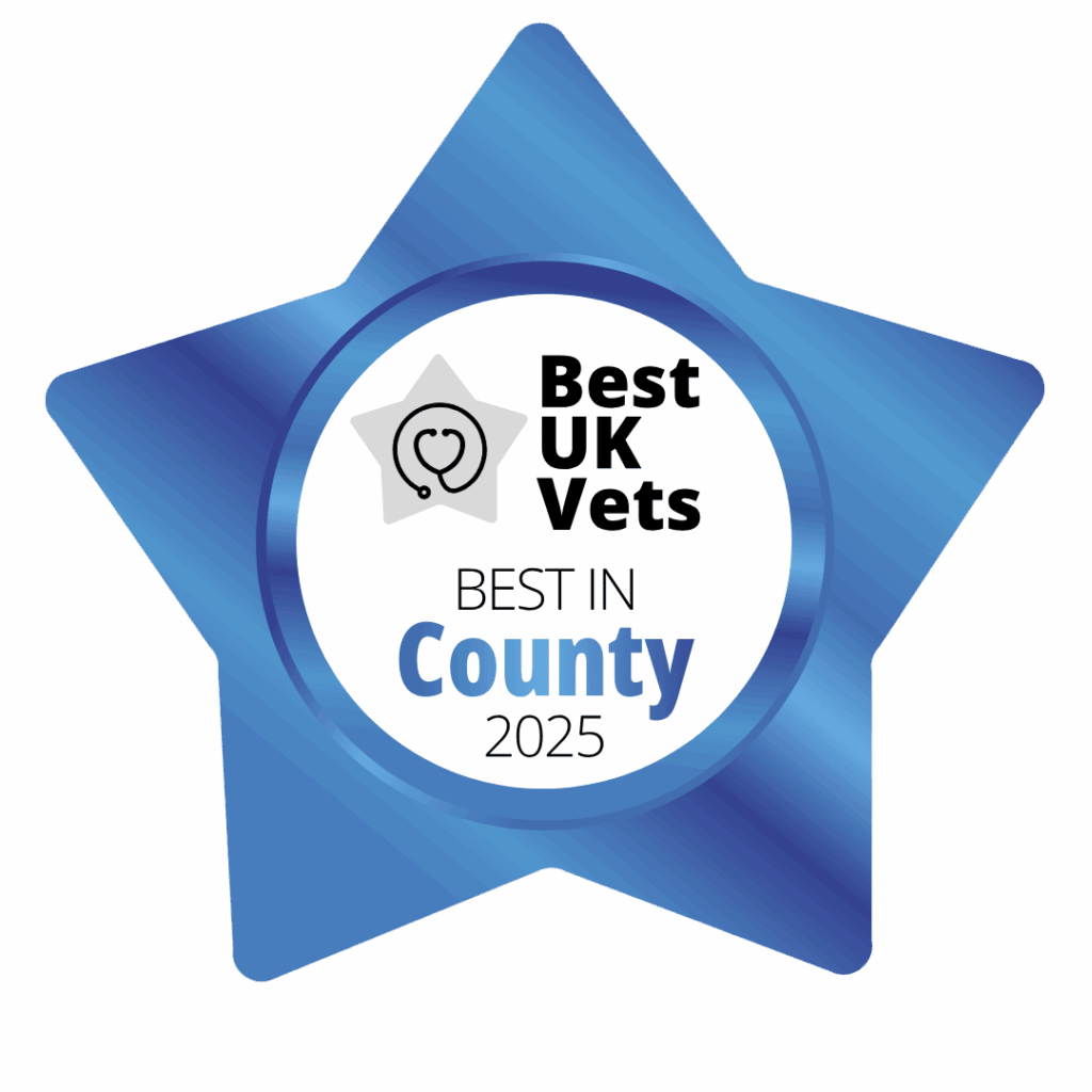 A blue, star-shaped badge with the words Best UK Vets, Best in County 2025 in the middle.