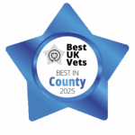 A blue, star-shaped badge with the words Best UK Vets, Best in County 2025 in the middle.