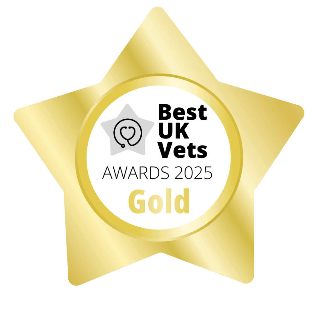 A gold, star-shaped badge with the words Best UK Vets Awards 2025 Gold. There is a heart and a stethoscope picture in the middle.