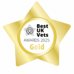 A gold, star-shaped badge with the words Best UK Vets Awards 2025 Gold. There is a heart and a stethoscope picture in the middle.