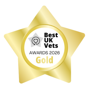 A gold star-shaped badge showing the words "Best UK Vets Awards 2026 Gold" and a picture of a stethoscope inside the star.